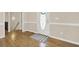 Foyer with hardwood floors, white trim and a front door with oval glass insert at 6218 Old Stilesboro Nw Rd, Acworth, GA 30101