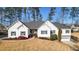 Beautiful single-story home with manicured front lawn, enhanced by the well-kept landscaping and charming details at 6218 Old Stilesboro Nw Rd, Acworth, GA 30101