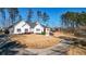 Beautiful home with a sprawling front lawn, long driveway, and a three-car garage, perfect curb appeal at 6218 Old Stilesboro Nw Rd, Acworth, GA 30101