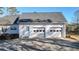Spacious three-car garage with automatic doors and exterior side entry, perfect for extra storage and convenience at 6218 Old Stilesboro Nw Rd, Acworth, GA 30101