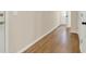 Hallway featuring beautiful hardwood floors, neutral wall paint and white trim at 6218 Old Stilesboro Nw Rd, Acworth, GA 30101