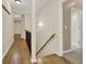 Bright hallway boasts hardwood floors, fresh paint, and access to the bathroom at 6218 Old Stilesboro Nw Rd, Acworth, GA 30101
