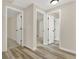 Hallway featuring white doors and neutral walls leading to various rooms in the home at 6218 Old Stilesboro Nw Rd, Acworth, GA 30101