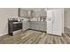 Kitchen featuring stainless steel appliances, gray cabinets, and sleek countertops at 6218 Old Stilesboro Nw Rd, Acworth, GA 30101