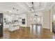 Open-concept kitchen featuring white cabinets, a center island, and hardwood flooring at 6218 Old Stilesboro Nw Rd, Acworth, GA 30101