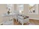 Close-up of a bright living room featuring wicker furniture, natural light and hardwood floors at 6218 Old Stilesboro Nw Rd, Acworth, GA 30101