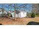 Detached outbuilding and storage shed in backyard, perfect for hobbies, workshop, or storing outdoor equipment at 6218 Old Stilesboro Nw Rd, Acworth, GA 30101