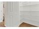 Walk-in pantry with white wire shelving and hardwood floors, offering ample storage space at 6218 Old Stilesboro Nw Rd, Acworth, GA 30101