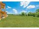 Expansive green backyard with a beautiful view of the neighboring properties and mature trees at 6428 East Cherokee Dr, Canton, GA 30115
