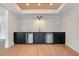 Basement bar area with custom cabinets, stainless dishwasher and beverage cooler at 6428 East Cherokee Dr, Canton, GA 30115