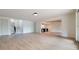 Spacious open basement with light wood floors and a bar area in the background at 6428 East Cherokee Dr, Canton, GA 30115