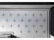 Detailed shot of the bathroom's black and white mosaic penny tile floor in a decorative pattern at 6428 East Cherokee Dr, Canton, GA 30115