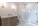 Elegant bathroom with a wood vanity, marble countertop, mosaic floors, and a glass-enclosed shower at 6428 East Cherokee Dr, Canton, GA 30115