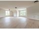 An expansive bonus room features natural light, neutral walls and floors and three storage closets at 6428 East Cherokee Dr, Canton, GA 30115