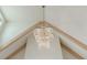 A closer look at a stunning multi-tiered chandelier, set against a backdrop of wood beams at 6428 East Cherokee Dr, Canton, GA 30115