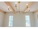 Chandelier with ceiling beams and transom windows at 6428 East Cherokee Dr, Canton, GA 30115