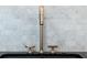 Close-up of a modern faucet with marble tile backsplash at 6428 East Cherokee Dr, Canton, GA 30115