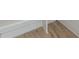 Close up on new hardwood flooring and molding with white trim at 6428 East Cherokee Dr, Canton, GA 30115