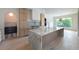 Open concept kitchen features marble island, stainless steel appliances and hardwood floors at 6428 East Cherokee Dr, Canton, GA 30115
