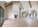 Bright and airy living room with high ceilings, wood beams, modern fireplace, and open staircase at 6428 East Cherokee Dr, Canton, GA 30115