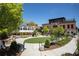 Outdoor space featuring a green lawn, brick building, and outdoor seating with mature landscaping at 6428 East Cherokee Dr, Canton, GA 30115