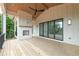 Spacious porch with fireplace and an outdoor ceiling fan providing a relaxing outdoor experience at 6428 East Cherokee Dr, Canton, GA 30115