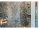 Detailed view of a stylish shower featuring gray gradient mosaic tile and gold fixtures at 6428 East Cherokee Dr, Canton, GA 30115