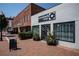 Storefront featuring a brick sidewalk, large windows, and a clean and modern facade at 6428 East Cherokee Dr, Canton, GA 30115