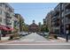 Charming street view featuring boutique shops, apartments with balconies, and ample parking at 6428 East Cherokee Dr, Canton, GA 30115