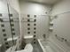 Clean bathroom featuring a shower-tub combination, tile surround, and modern fixtures at 6927 Eunice Dr, Riverdale, GA 30274