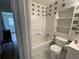 Bathroom with a tub-shower combination and tile details at 6927 Eunice Dr, Riverdale, GA 30274