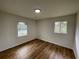 Cozy bedroom featuring natural light and hardwood floors, freshly painted walls at 6927 Eunice Dr, Riverdale, GA 30274