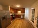Modern kitchen with stainless steel appliances, wood cabinets, and a stylish backsplash at 6927 Eunice Dr, Riverdale, GA 30274