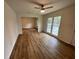 Bright living room featuring hardwood floors and large windows for natural light at 6927 Eunice Dr, Riverdale, GA 30274