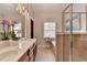 Bright bathroom with double sinks, hardwood cabinets, and large shower at 7435 Jamestown Dr, Alpharetta, GA 30005