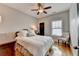 Comfortable bedroom with hardwood floors, ceiling fan, and natural light from the window at 7435 Jamestown Dr, Alpharetta, GA 30005