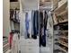 Organized walk-in closet with shelving, hanging space, and storage for clothing and accessories at 7435 Jamestown Dr, Alpharetta, GA 30005