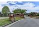 Brick Jamestown community entrance with manicured landscaping at 7435 Jamestown Dr, Alpharetta, GA 30005