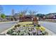 Community entrance featuring lush flower beds and brick monument at 7435 Jamestown Dr, Alpharetta, GA 30005