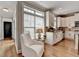 Bright eat-in kitchen with white cabinets, stainless appliances, granite counters and hardwood floors at 7435 Jamestown Dr, Alpharetta, GA 30005