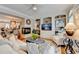 Elegant living room featuring a fireplace, built-in shelving, and abundant natural light, perfect for relaxing and entertaining at 7435 Jamestown Dr, Alpharetta, GA 30005