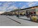 Outdoor view of a popular retail shopping center with restaurants and storefronts under a cloudy sky at 7435 Jamestown Dr, Alpharetta, GA 30005
