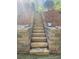 Backyard hardscape featuring newly built stone steps and retaining wall at 125 Forrest Lake Rd, Johns Creek, GA 30022