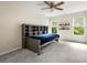 Comfortable bedroom with storage headboard, hardwood floors, and natural lighting at 125 Forrest Lake Rd, Johns Creek, GA 30022