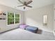 Cozy bedroom with neutral walls, large windows and plush carpet at 125 Forrest Lake Rd, Johns Creek, GA 30022