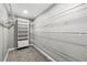 Walk-in closet with wire shelving, built-in drawers, and plush carpeted floor at 125 Forrest Lake Rd, Johns Creek, GA 30022