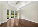 Light-filled dining room with hardwood floors, stylish light fixture and large bay window at 125 Forrest Lake Rd, Johns Creek, GA 30022