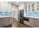 The kitchen features stainless steel appliances, ample counter space, and neutral cabinets at 125 Forrest Lake Rd, Johns Creek, GA 30022