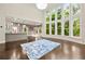 Spacious living room with large windows, hardwood floors, and modern decor at 125 Forrest Lake Rd, Johns Creek, GA 30022