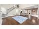 View of open floor plan with modern kitchen, staircase and hardwood floors at 125 Forrest Lake Rd, Johns Creek, GA 30022